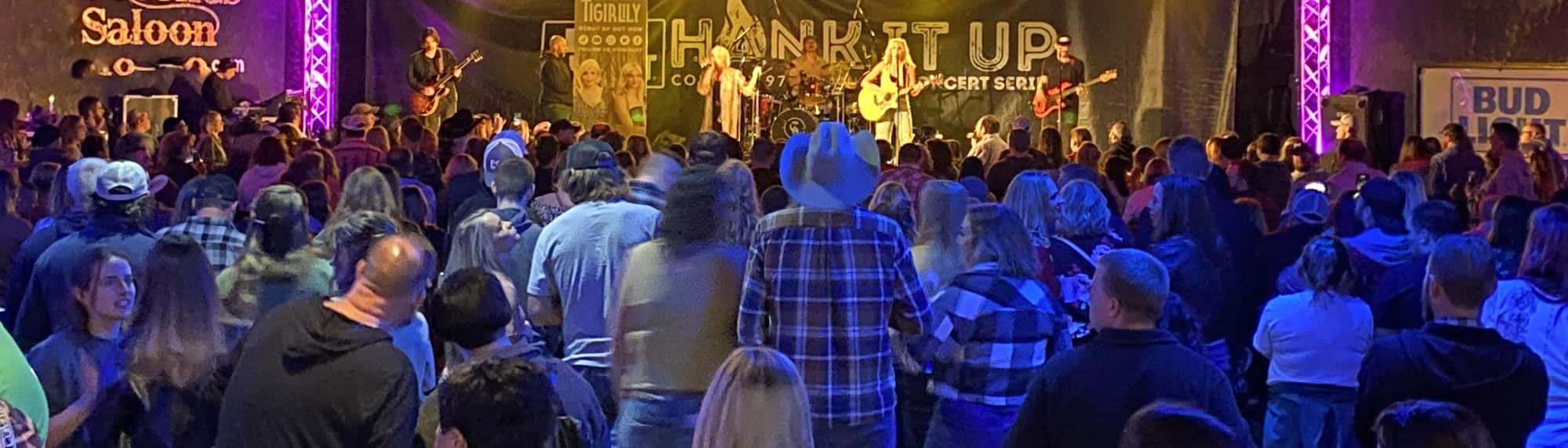 country concert with fans wearing cowboy hats Fort Wayne