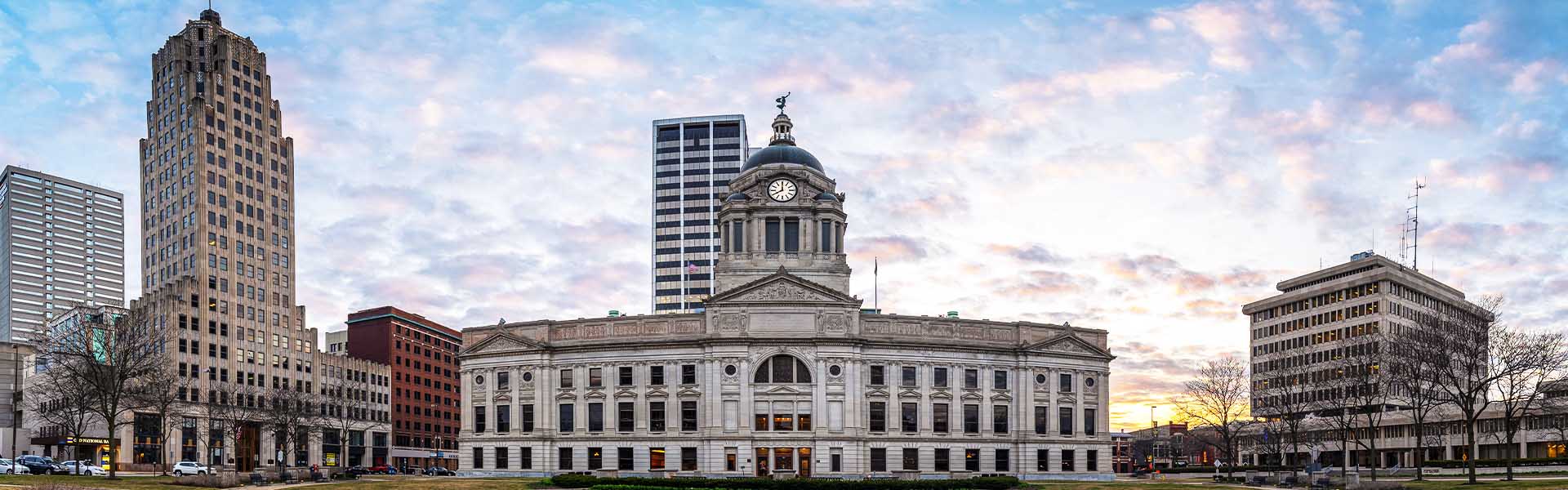 Neon color image of a band playing and people singing along